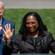 Judge Ketanji Brown Jackson, accompanied by President Joe Biden, waves as she takes the podium to speak during an event on the South Lawn of the White House in Washington, Friday, April 8, 2022, celebrating the confirmation of Jackson as the first Black woman to reach the Supreme Court.